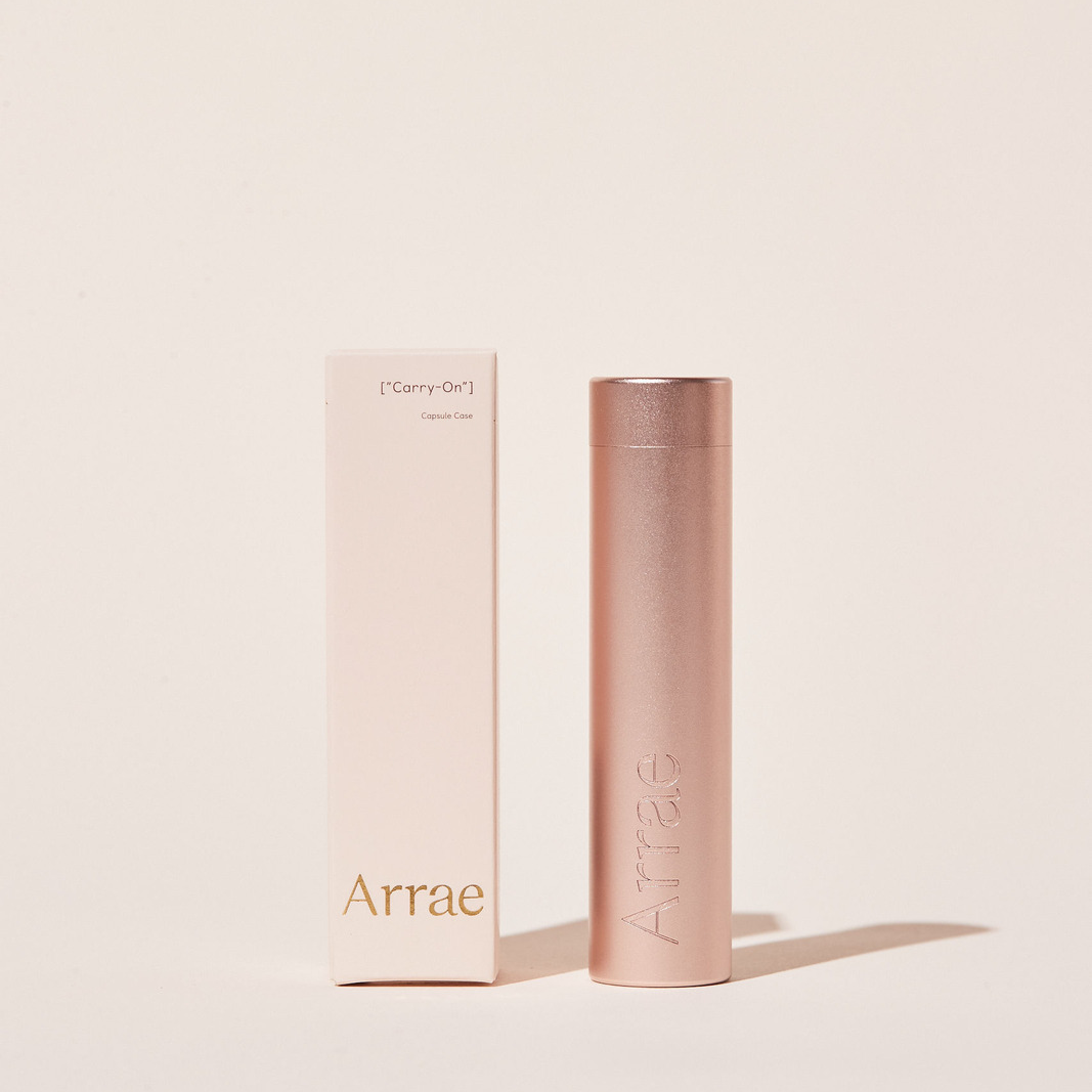 Arrae Carry-On Capsule Case Rose Gold - A compact and durable tube-shaped travel case designed to store up to 10 Arrae Capsules.